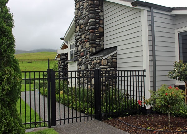 Contemporary-Fence-and-gate-on-a-modern-home-finishes-off-the-entry-to-the-backyard-perfectly-IN-SATIN-BLACK-min